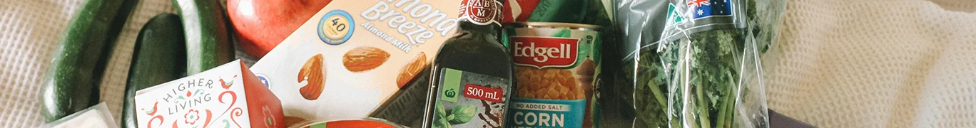 Assorted grocery items including almond milk, balsamic vinegar, bananas, and more.